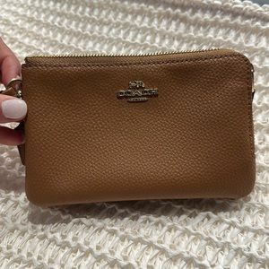 Tan Medium Brown Coach Wristlet. Used a handful of times in excellent condition.